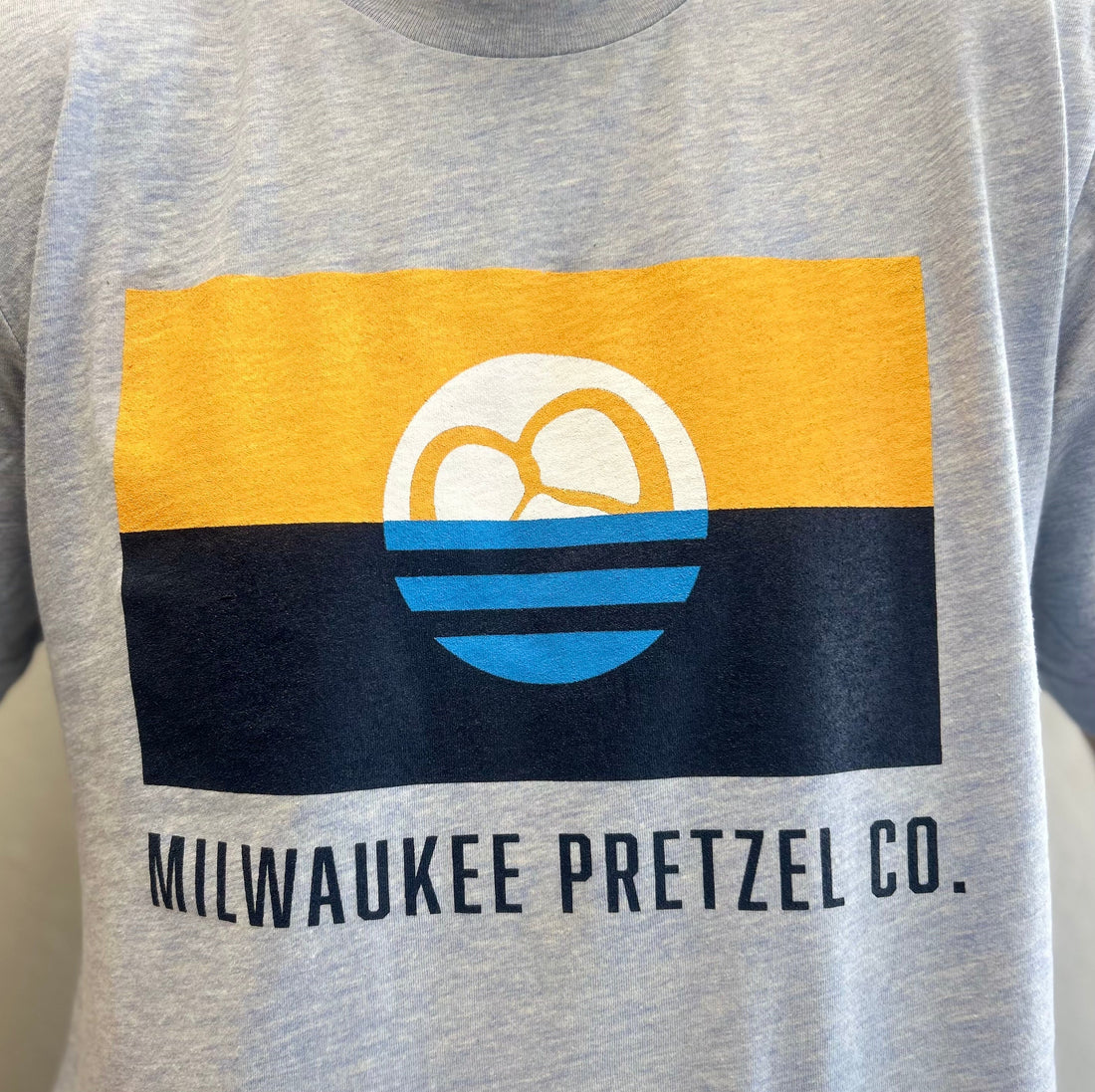 Milwaukee Pretzel Company gray short sleeve t-shirt with Milwaukee Flag